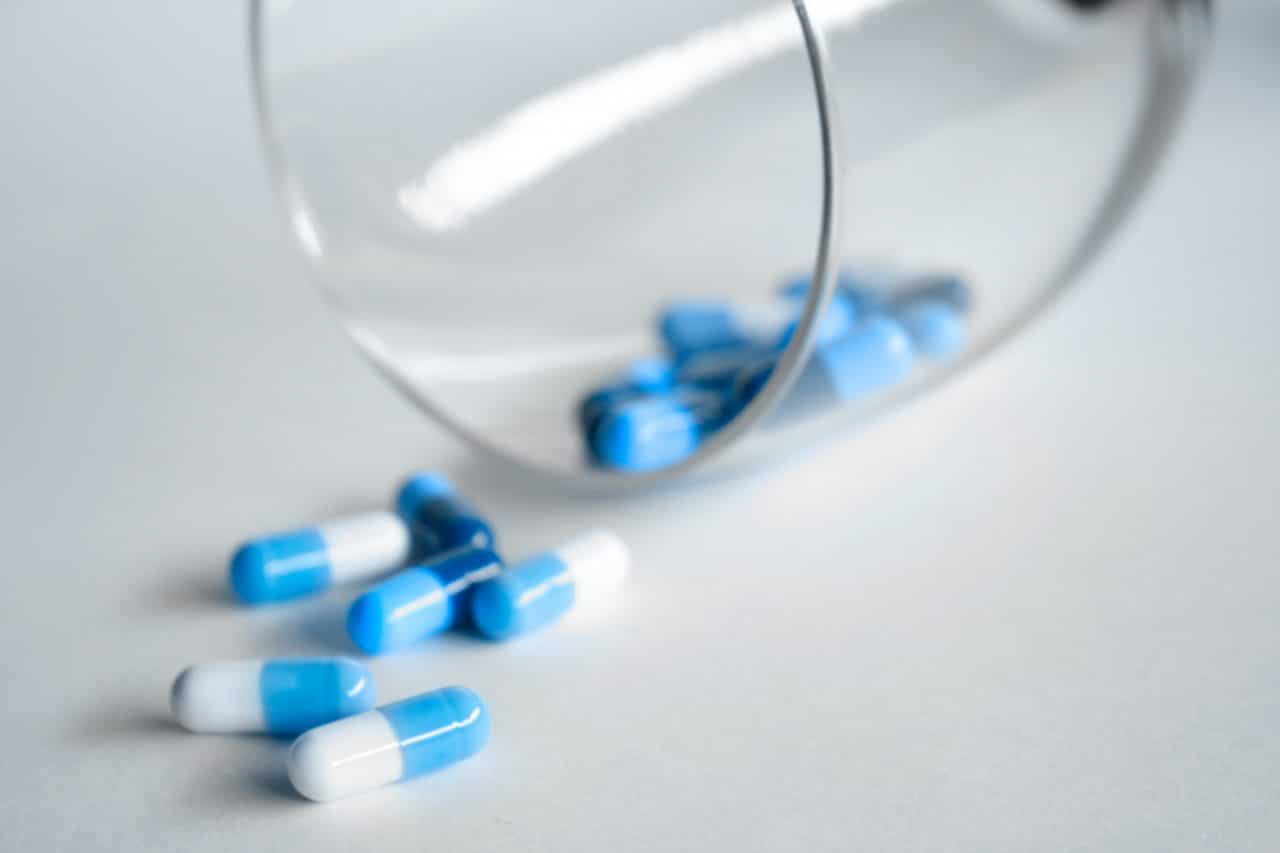 Generic blue and white pill capsules.