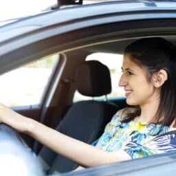 Woman driving with hearing aids