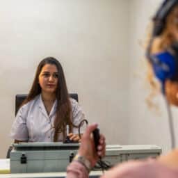 Audiologist administering a hearing test.
