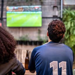 Friends watch football game together